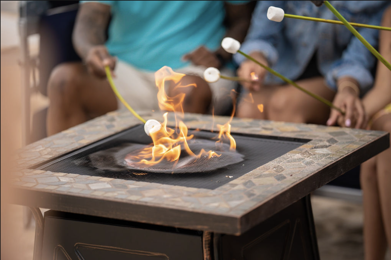 zoomed in look at fire pit and people sitting around it